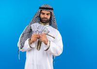 arabic-man-traditional-wear-showing-cash-looking-with-confident-serious-expression-standing-blue-wall